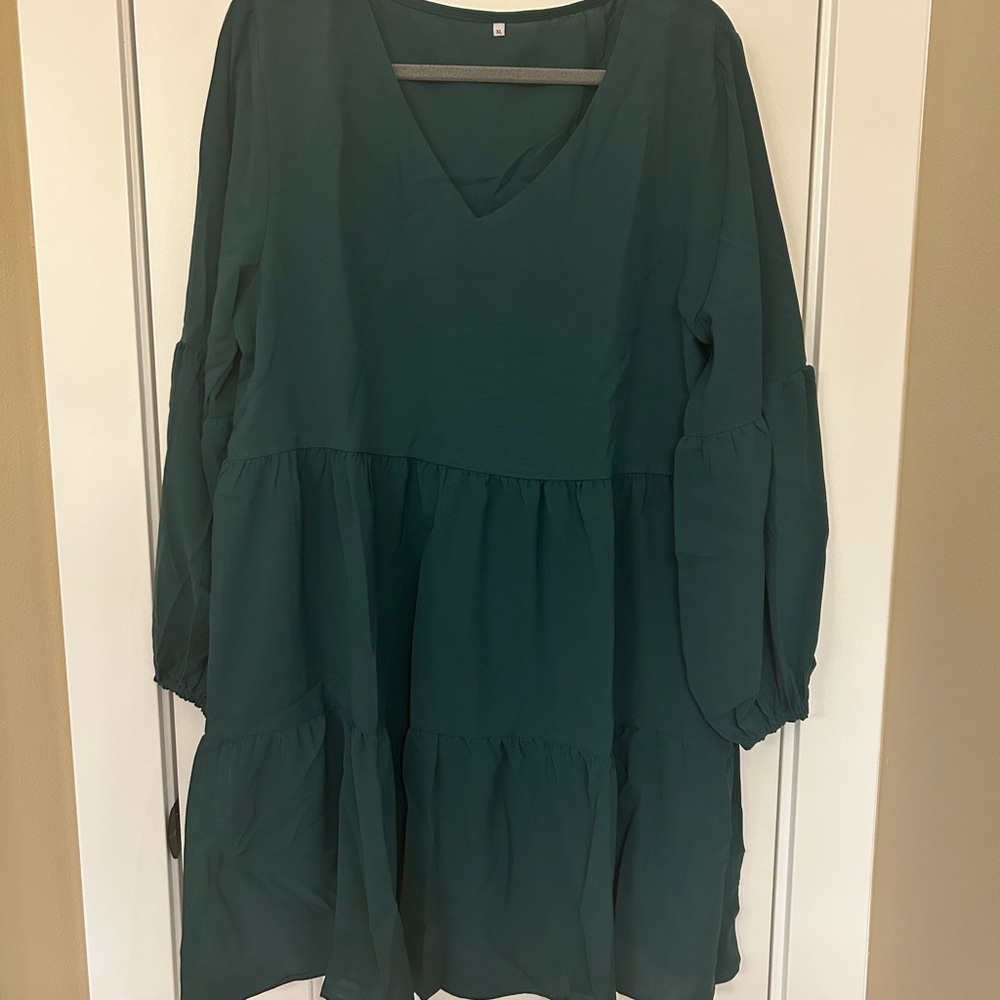 Flowy Green dress with long sleeves. Brand new never worn.